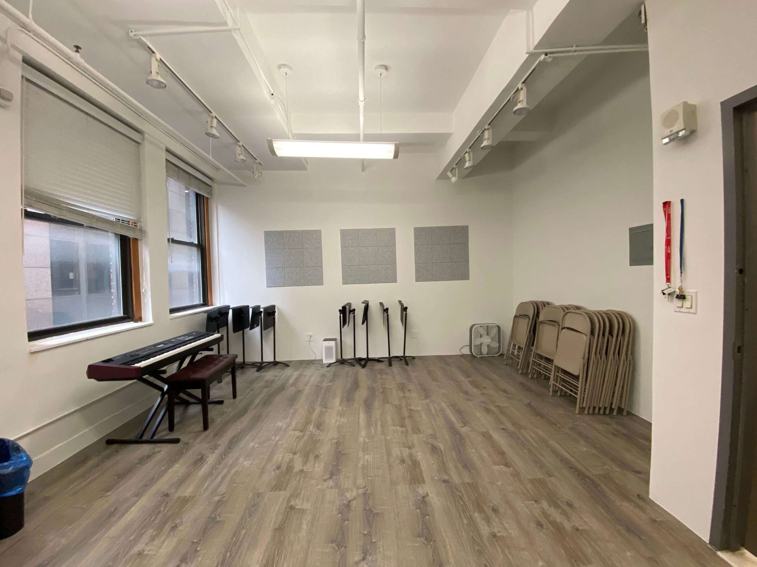 CAM 3 studio with piano, windows, and chairs for new-work development